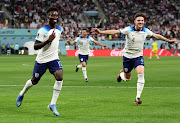 Bukayo Saka of England celebrates after scoring their team's second goal during the FIFA World Cup Qatar 2022 Group B match between England and IR Iran at Khalifa International Stadium on November 21, 2022 in Doha, Qatar. 