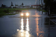 A street under water after heavy overnight rain in Hanover Park, Cape Flats.