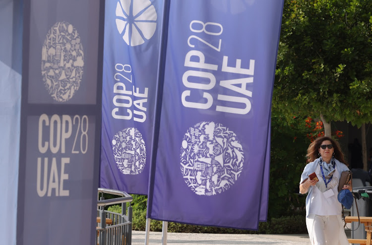 Banners at the COP28 Climate Conference in Dubai. Picture: SEAN GALLUP