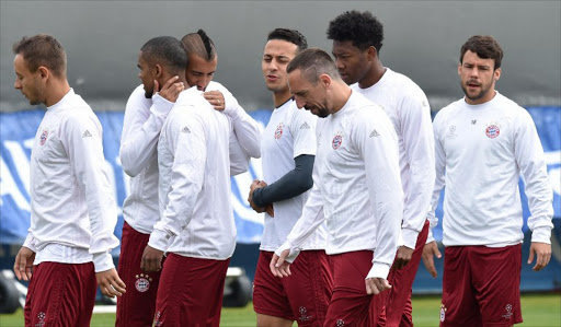 Bayern Munich's Brazilian defender Rafinha, Bayern Munich's Brazilian midfielder Douglas Costa, Bayern Munich's Chilean midfielder Arturo Vidal, Bayern Munich's Spanish midfielder Thiago Alcantara, Bayern Munich's French midfielder Franck Ribery, Bayern Munich's Austrian defender David Alaba and Bayern Munich's Spanish defender Juan Bernat attend a training session at the team's training grounds in Munich, southern Germany, on April 11, 2017, on the eve of the UEFA Champions League quarterfinal football match between FC Bayern Munich and Real Madrid.