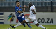 Samuel Manganyi, Captain of Royal AM FC challenges Daylon Claasen of Maritzburg United during the DStv Premiership 2021/22 match between Maritzburg United and Royal AM.