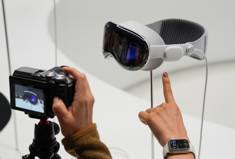 A person uses a camera as Apple's Vision Pro headset is on display at Apple's annual Worldwide Developers Conference at the company's headquarters in Cupertino, California, U.S. June 5, 2023.