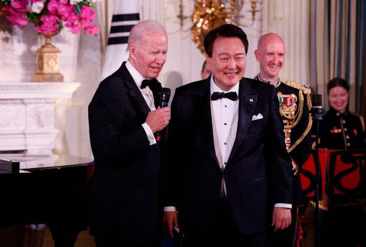 US President Joe Biden and South Korea’s President Yoon Suk-yeol react at an official State Dinner at the White House in Washington, the US, April 26 2023. Picture: EVELYN HOCKSTEIN/REUTERS