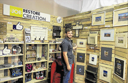 RECYCLE AND REUSE: Shaun Gunton of Restore Job Creation sells whimsical homeware made of wood pallets at Your Home Expo