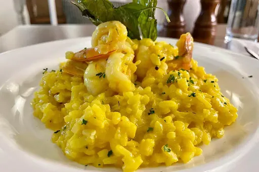 Prawns Saffron Risotto With Lemon Zest And Crispy Garnish