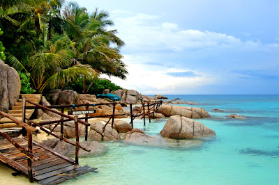 Clear sea water and beach stones on Koh Nangyuan