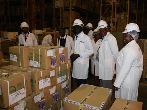 Nairobi Health executive Vesca Kangogo (R) with Kemsa bosses during the resumption of medicine supplies to city hospitals, August 16, 2018. /GPS