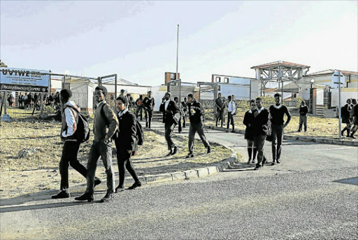 LONG WALK: Thousands of Eastern Cape pupils may lose out on the scholar transport programme next year due to an administrative bungle by school principal Picture: SIBONGILE NGALWA