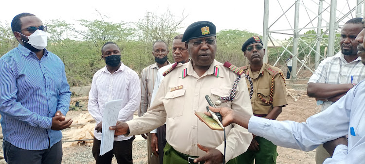 Garissa county commissioner Boaz Cherutich assessing the progress of Garissa town water supply and sewerage infrastructure last mile connectivity project on Tuesday, March 8.