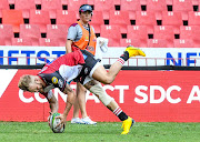 Tyrone Green of the Lions scores a try during the Super Rugby match against the Reds at Ellis Park.