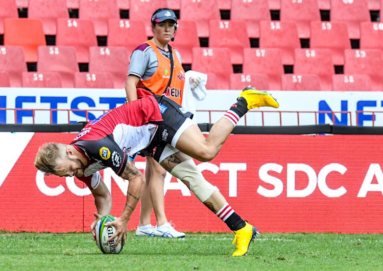 Tyrone Green of the Lions scores a try during the Super Rugby match against the Reds at Ellis Park.