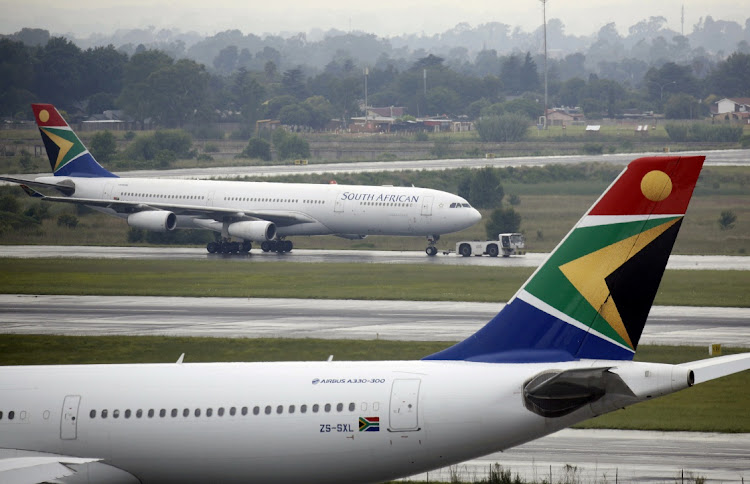 An SAA plane is towed at OR Tambo International Airport in Johannesburg in January