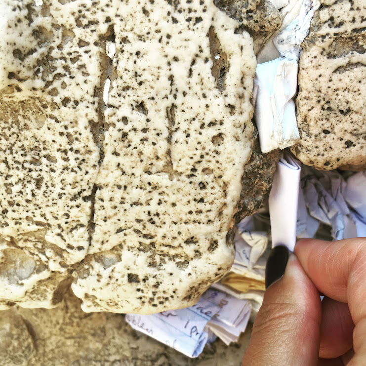 Leaving a wish in the Kotel, Jerusalem, Israel