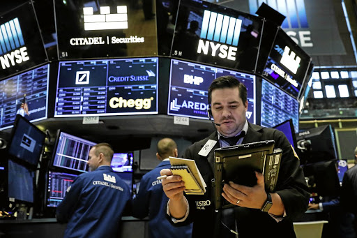 Traders work on the floor of the New York Stock Exchange. Picture: REUTERS