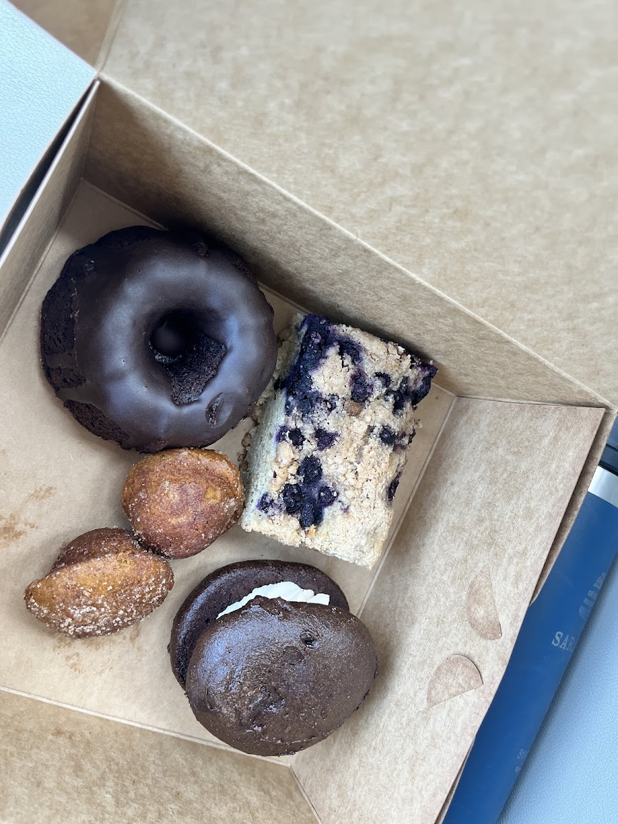 Chocolate bundt cake, blueberry coffee cake, donut holes, and whoopie pie