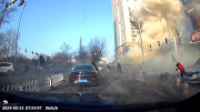 A dashcam view shows people fleeing following an explosion in Sanhe, Langfang City, Hebei Province, China in this screen grab from video obtained by Reuters March 13, 2024. 