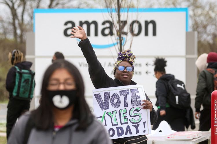 An Amazon Labour Union organiser greets workers outside Amazon’s distribution centre in the Staten Island borough of New York City, the US, April 25 2022. Picture: BRENDAN MCDERMID/REUTERS