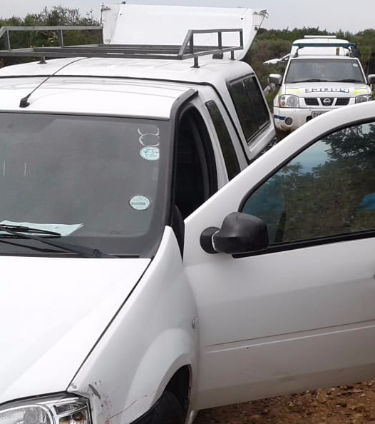 Police stand at the hijacked courier vehicle that was found back in Wells Estate on Monday morning.