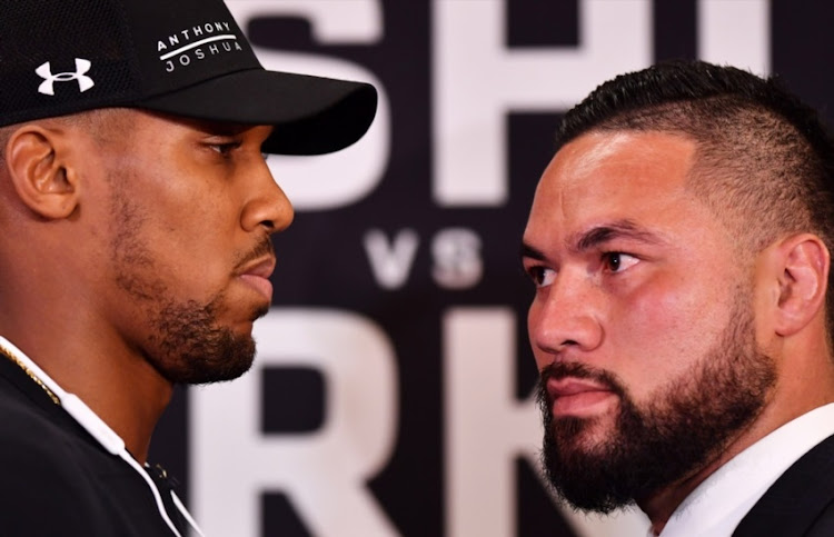 Anthony Joshua and Joseph Parker square up during an Anthony Joshua and Joseph Parker Press Conference at the Dorchester Hotel on January 16, 2018 in London, England.
