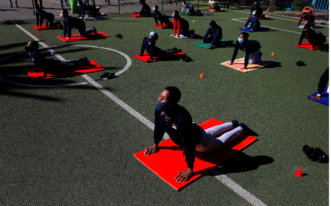 Pupils at the City Kidz Pre & Primary School, in the Johannesburg Inner City, take part in a yoga class, held by Dale de Klerk, on June 10 2020.