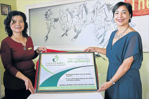 OPENING DOORS: The principal of the New Oriental Chinese Language School, Leqin Zhu, and Frere Hospital CEO Rolene Wagner at the launch of the schoolPicture: SIBONGILE NGALWA