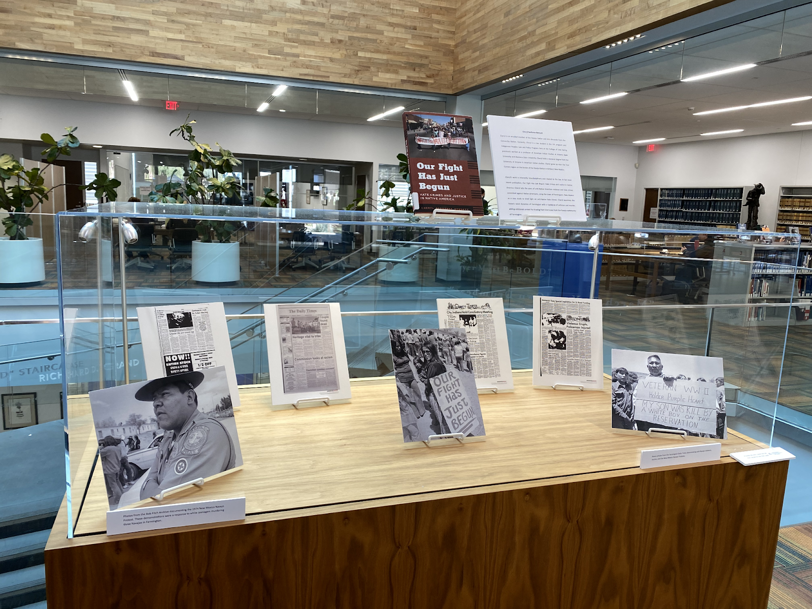 A photograph of Cheryl's exhibit which includes archival photos of Navajo protests in Farmington, New Mexico.