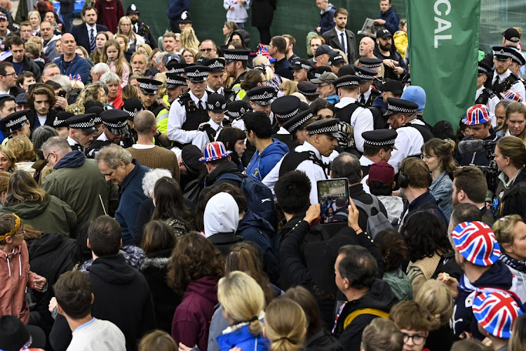 Protesters from climate protest group 'Just Stop Oil' are apprehended by police officers in the crowd close to where Britain's King Charles III and Britain's Camilla, Queen Consort will be crowned at Westminster Abbey on May 6, 2023 in London, England. The Coronation of Charles III and his wife, Camilla, as King and Queen of the United Kingdom of Great Britain and Northern Ireland, and the other Commonwealth realms takes place at Westminster Abbey today. Charles acceded to the throne on 8 September 2022, upon the death of his mother, Elizabeth II.