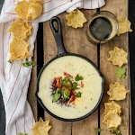 Easy Restaurant Style White Queso was pinched from <a href="http://www.thecookierookie.com/easy-restaurant-style-white-queso/" target="_blank">www.thecookierookie.com.</a>