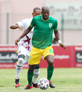 Velemseni Ndwandwe of Lamontville Golden Arrows and Vuyo Mere of Moroka Swallows during the DStv Premiership match between Golden Arrows and Swallows at Sugar Ray Xulu Stadium on December 05, 2020 in Durban.