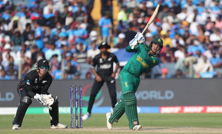 Proteas' Quinton de Kock plays a shot during the ICC Men's Cricket World Cup 2023 match against New Zealand at MCA International Stadium on November 1 2023 in Pune, India.