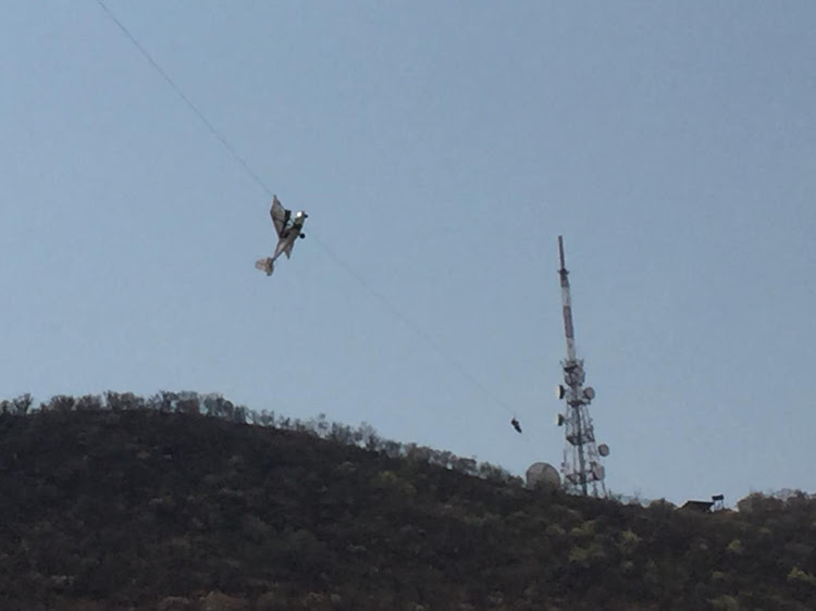 A man and woman were rescued this afternoon from their light aircraft after it became entangled in a zip-line approximately 300 metres above the ground at a resort outside of Rustenburg.