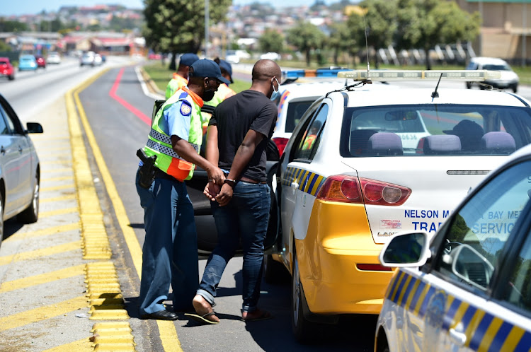 A man is arrested for alleged drunk driving during a roadblock in Gelvandale on Sunday