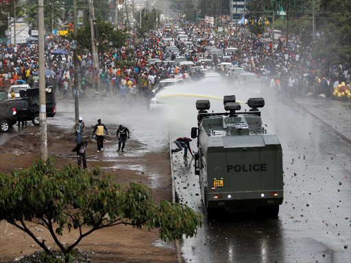 Policemen spray water to disperse supporters of Opposition leader Raila Odinga in Nairobi, Kenya November 17, 2017. /REUTERS