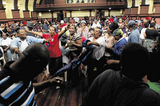 ACTION SOUGHT: Samwu workers stage a sit-in at the East London City Hall to demand answers from Buffalo City mayor Alfred Mtsi over salary increases and other grievances Picture SINO MAJANGAZA