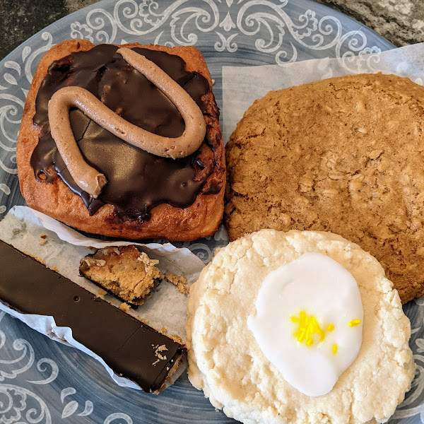 Chocolate peanut butter cream filled square donut, lemon shortbread cookie, chewy oat cookie and "Twix" bar.