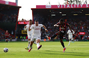 AFC Bournemouth's Luis Sinisterra shoots at goal as Manchester United's Diogo Dalot reacts in the Premier League match at Vitality Stadium in Bournemouth on Saturday.