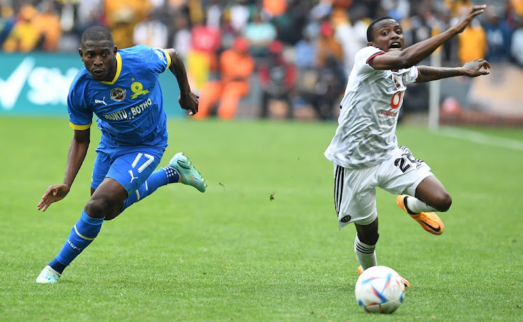 Aubrey Modiba of Mamelodi Sundowns and Ntsako Makhubela of Orlando Pirates during the Carling Black Label Cup final match at FNB Stadium on November 12 2022.