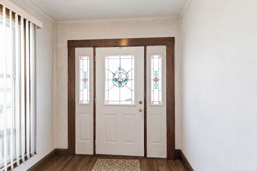 front door with decorative stained glass in this luxury property for sale in Lyndhurst ($499,999)