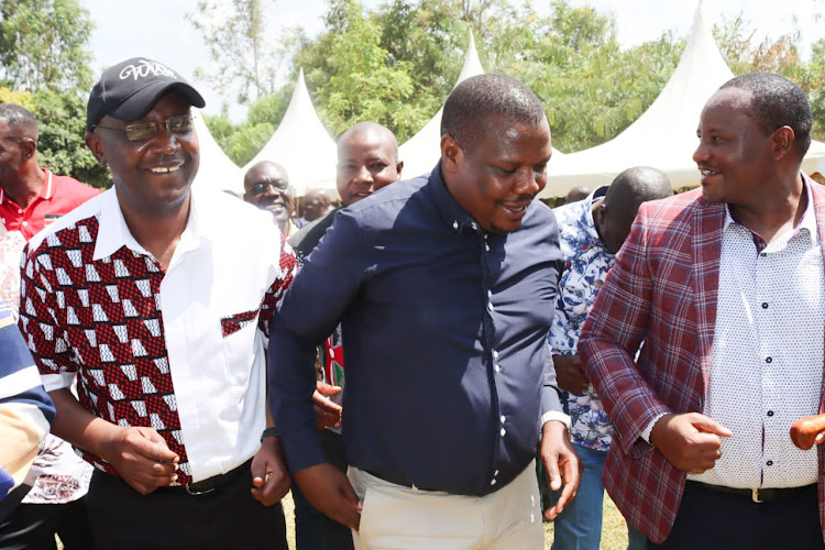 Former Governor Wycliffe Wangamati, Bumula lawmaker Jack Wamboka and Mwambu Mabonga enjoying a traditional dance.