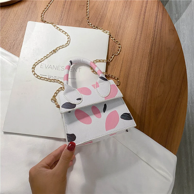 Bolso de mano para mujer de moda color caramelo mini, ideal para llevar tus esenciales diarios con estilo y ligereza.