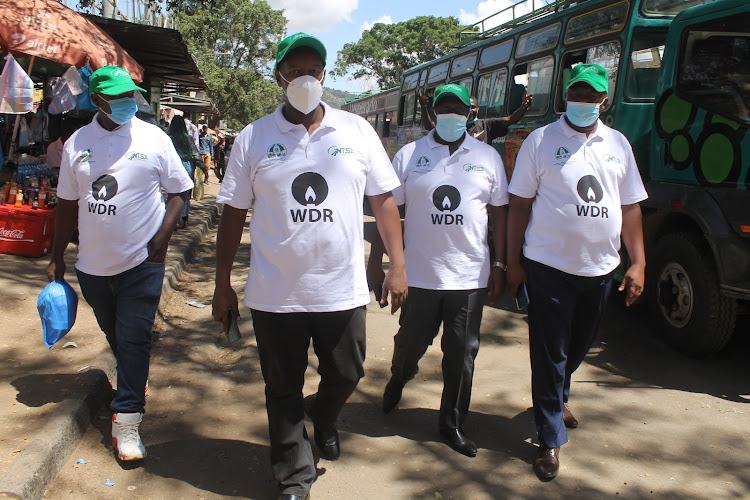 Lower Eastern Transporters Welfare Association chairman Onesmus Kyalo (2L) with other matatu sector players during the World Day of Remembrance celebrations at Machakos Bus Park on Sunday.