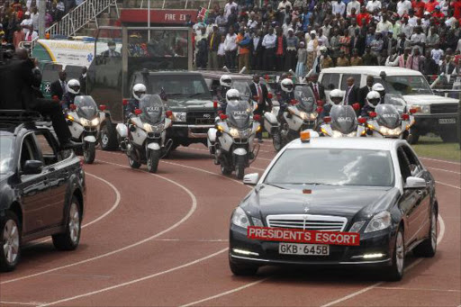 A file photo of President Uhuru Kenyatta arriving for Mashujaa day celebrations at the Nyayo Stadium in Nairobi in 2014. /MONICAH MWANGI