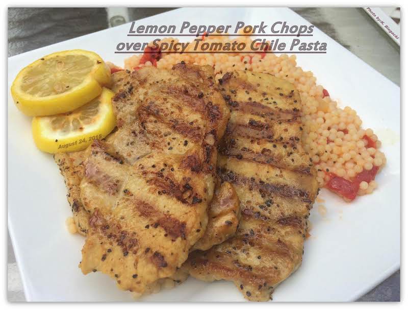 Lemon Pepper Pork Chops Over Spicy Tomato Chile Pasta