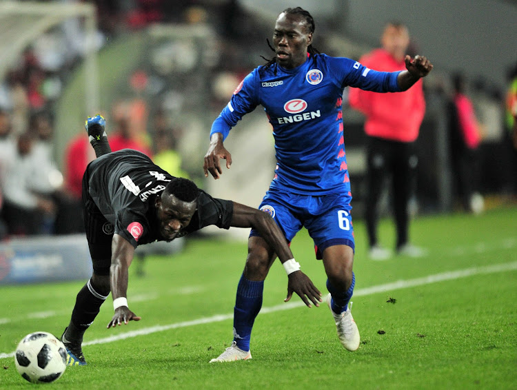 SuperSport United midfielder Reneilwe Letsholonyane (R) vies for the ball with Augustine Mulenga of Orlando Pirates during the Absa Premiership match at Orlando Stadium in Soweto, south west of Johannesburg, on September 15 2018.