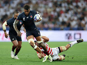 Courtney Lawes of England makes a breaks past Pieter Labuschagne of Japan during the Rugby World Cup France 2023 match between England and Japan at Stade de Nice on September 17, 2023 in Nice, France.