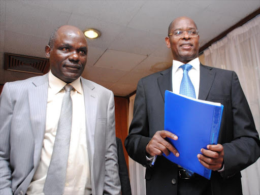 IEBC chairman nominee Wafula Chebukati and former EACC chairman Philip Kinisu on July 19 last year /FILE