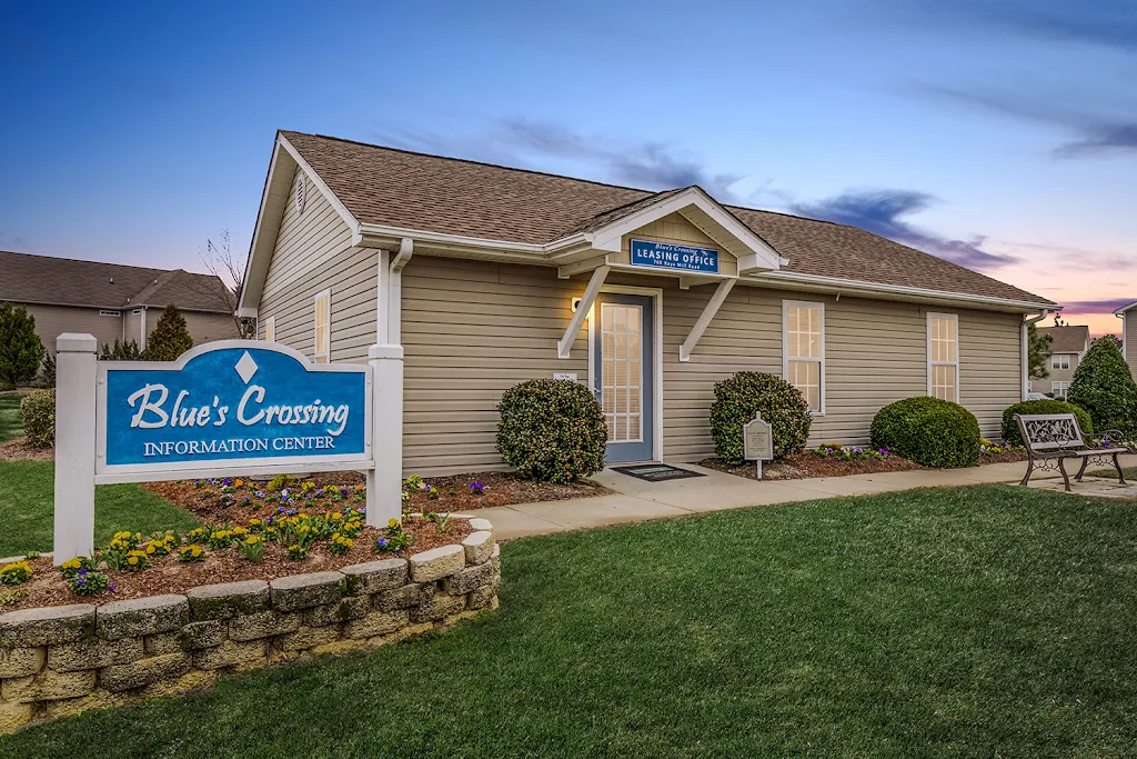 Leasing office exterior with apartment sign at dusk1