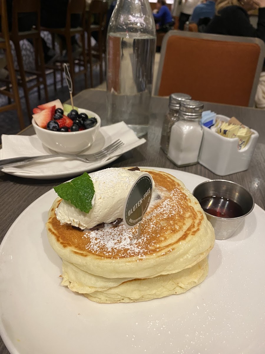 chocolate chip pancakes with a small side of fruit