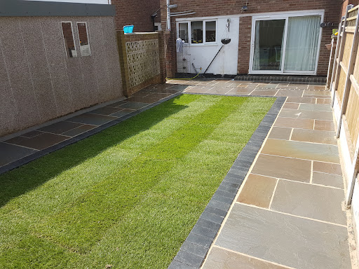 Autum blend sandstone with charcoal boarder and new turf