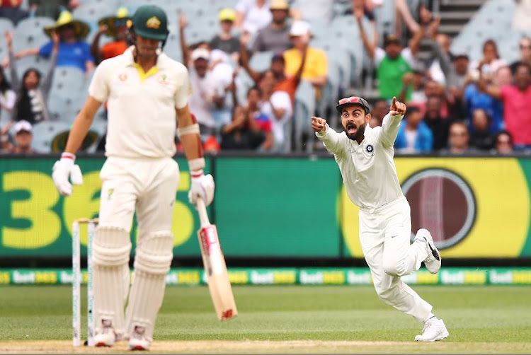 Indian captain Virat Kohli reacts after the dismissal of Pat Cummins of Australia during day five of the Third Test at Melbourne Cricket Ground on Sunday. Cummins was the Australians' last resistance as he top-scored with 63 off 114 balls.